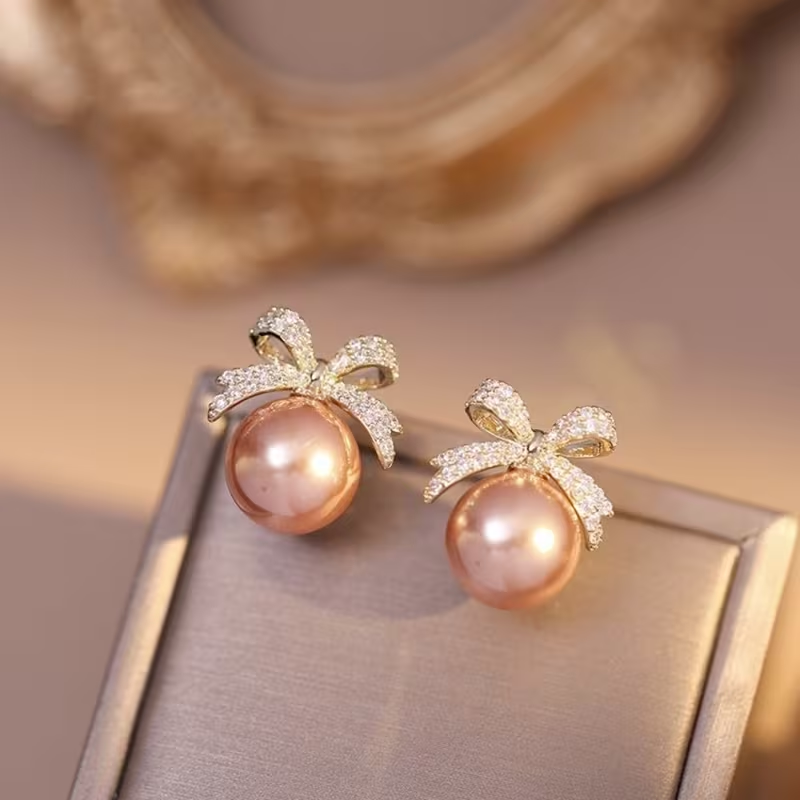 Pink Pearl Bow Stud Earrings – Gold Tone