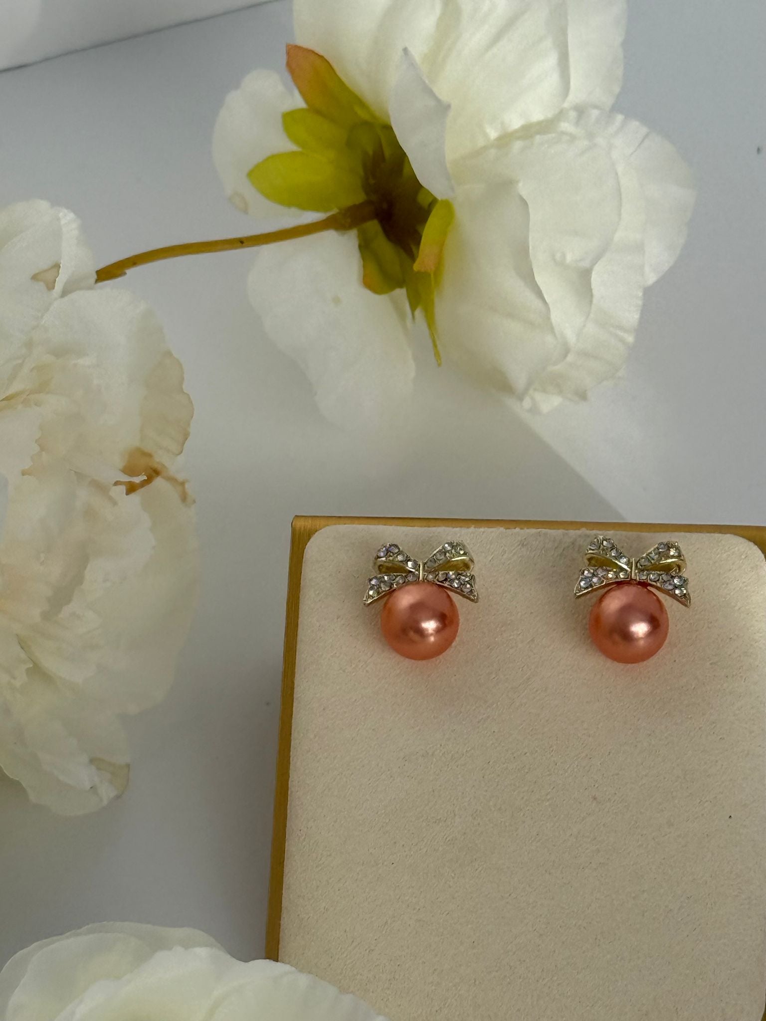 Pink Pearl Bow Stud Earrings – Gold Tone